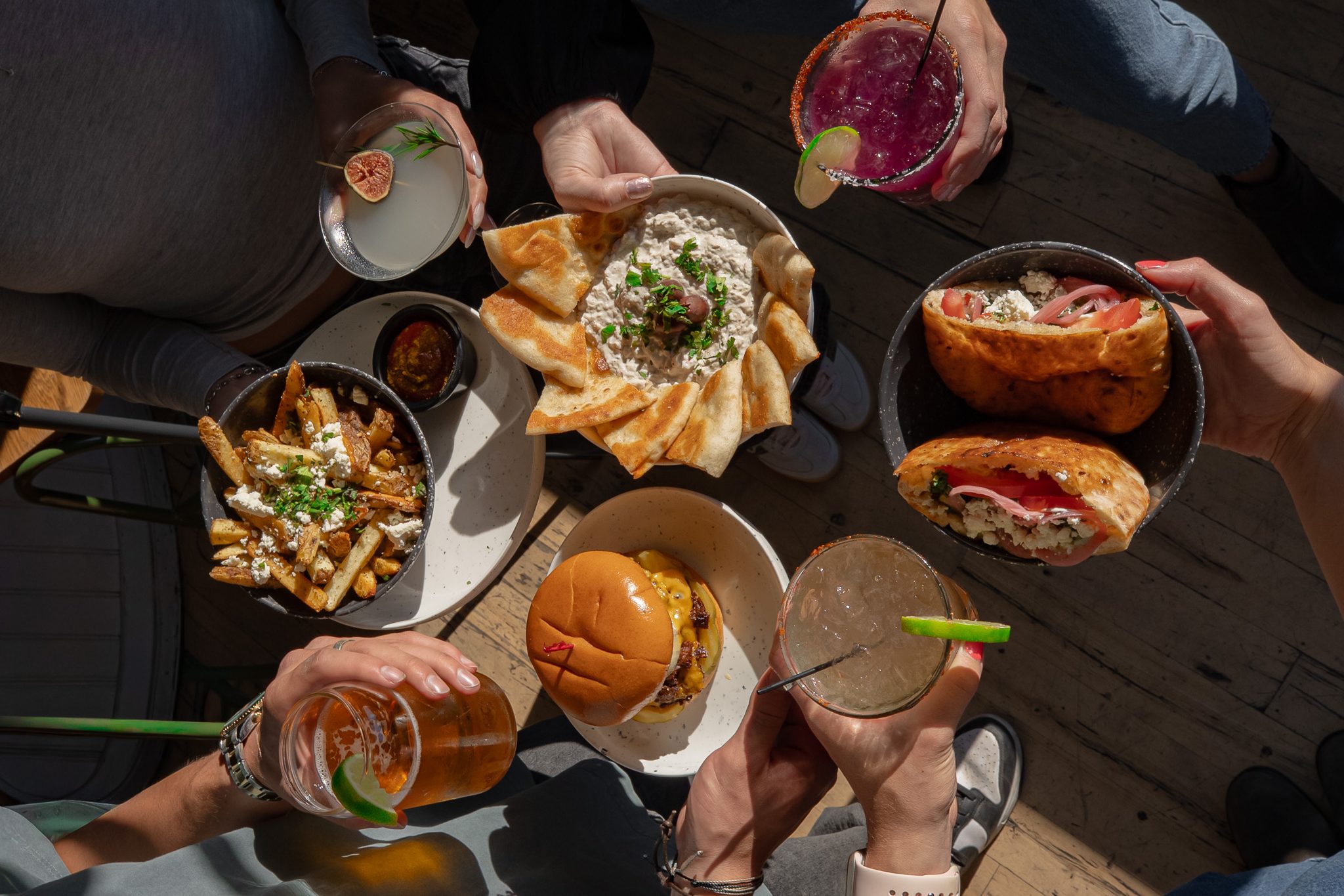 Mediterranean to-go spread from The Jesse Kitchen in downtown Reno featuring hummus, pita, kebabs, and shareable sides