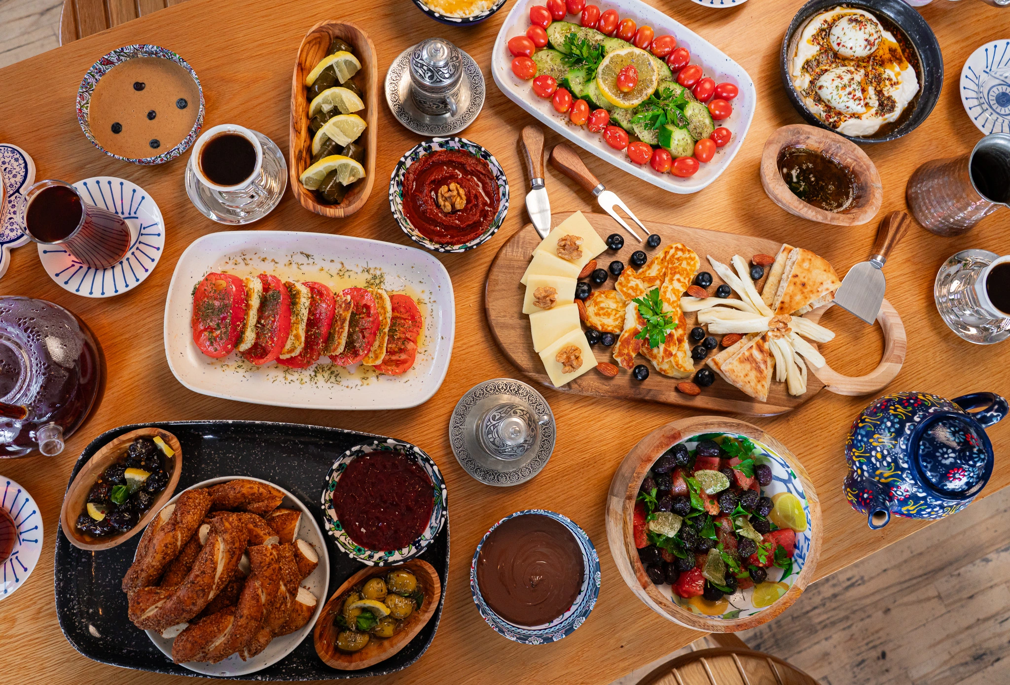 A full Turkish breakfast spread at The Jesse in downtown Reno, with simit, olives, cheeses, bal-kaymak, and gozleme served on a Sunday morning.